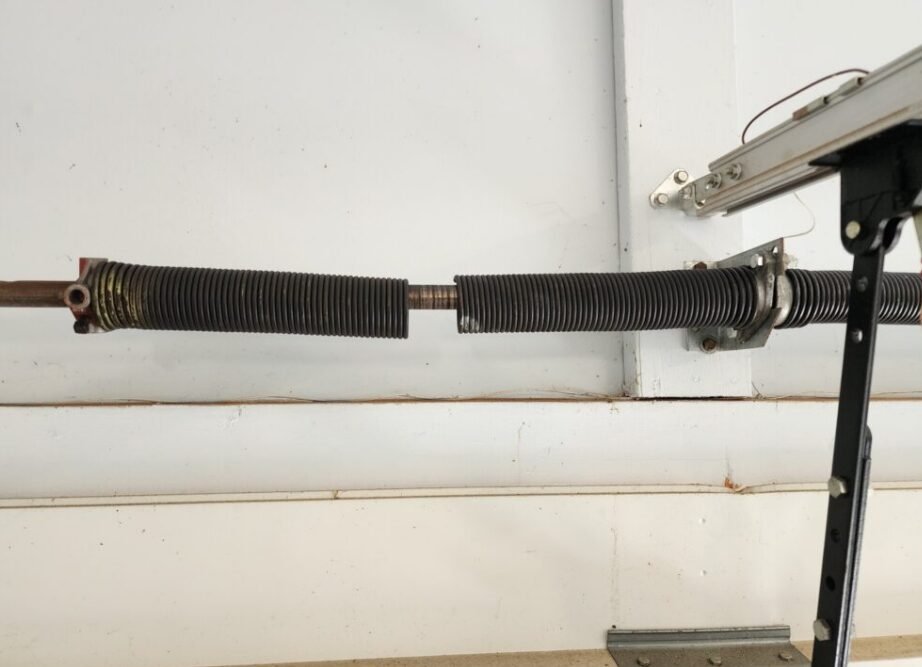Technician performing garage door spring repair in Delaware, Ohio - Expert garage door service for safe and reliable operation